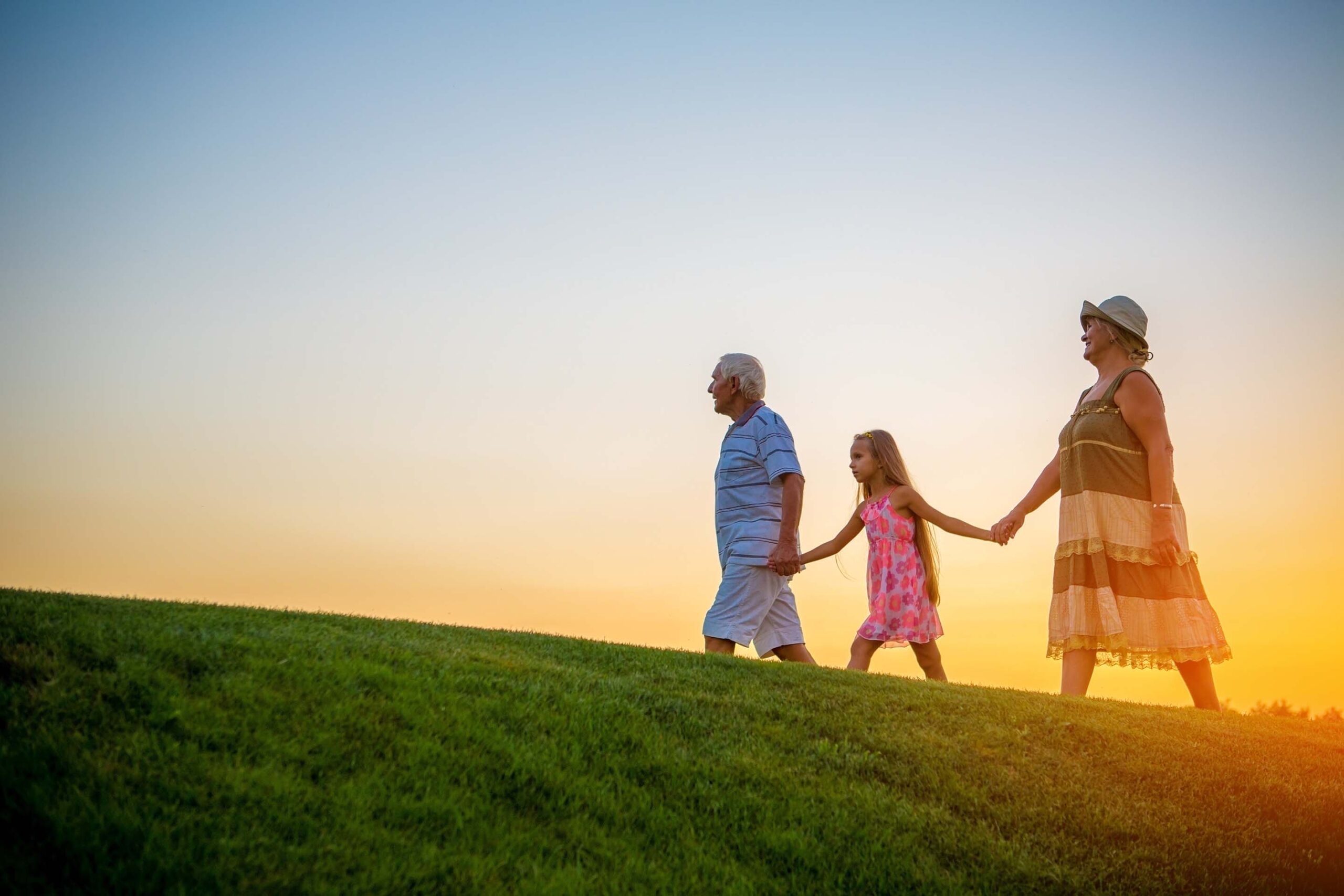 Grandparents and kids on hill